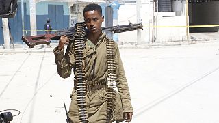 A soldier patrols outside the Hayat Hotel in Mogadishu on 20 August 2022