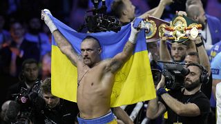 Ukraine's Oleksandr Usyk celebrates after beating Britain's Anthony Joshua to retain his world heavyweight title