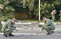 Des enquêteurs sur le site de l'explosion d'une voiture conduite par Daria Douguina, 21/07/2022
