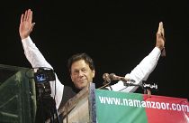 Former Pakistani Prime Minister Imran Khan waves to his supporters during an anti government rally, in Lahore, Pakistan, April 21, 2022.