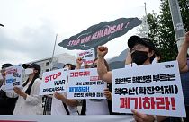 Protesters stage a rally to oppose the joint military exercises between the U.S. and South Korea in front of the presidential office in Seoul, South Korea, Aug. 22, 2022.