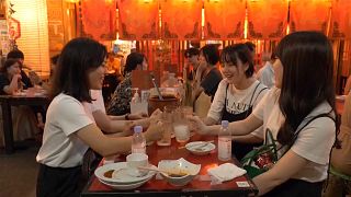A group of women enjoying an evening out in a restaurant in Tokyo, Japan.