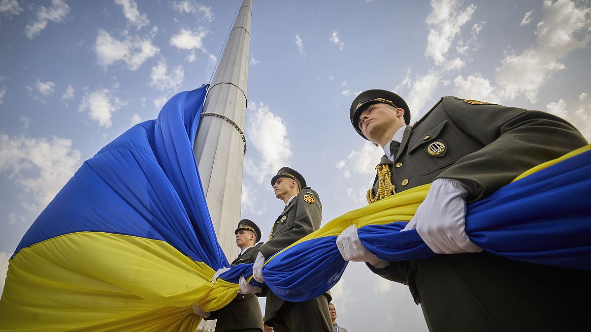 Ukrainian honour guard soldiers prepare to rise the Ukrainian national flag during State Flag Day celebrations in Kyiv, Aug. 23, 2022. 