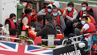 A group of people thought to be migrants are brought onboard a Border Force vessel to Dover, Kent, Monday Aug. 22, 2022