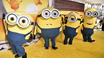 Minions Bob, from left, Otto, Stuart and Dave arrive at the Los Angeles premier of "Minions: The Rise of Gru," on Saturday, June 25, 2022, at the TCL Chinese Theatre in LA.