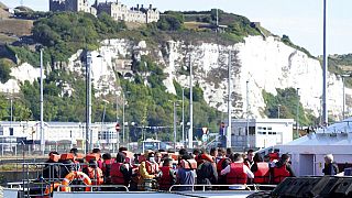 A group of people thought to be migrants are brought into Dover, from a Border Force Vessel, following a small boat incident on the Channel, in Kent, England, Tuesday, Aug. 23