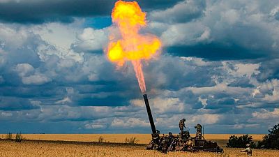 Russian soldiers fire a 2S4 Tyulpan self-propelled heavy mortar from their position at an undisclosed location in Ukraine