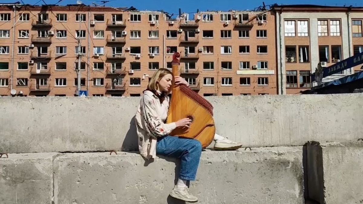 Maryna Krut, renowned Ukrainian singer and songwriter playing the bandura, a traditional Ukrainian string instrument