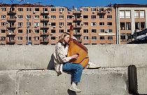 Maryna Krut, renowned Ukrainian singer and songwriter playing the bandura, a traditional Ukrainian string instrument
