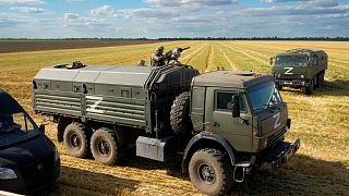 A Russian soldier atop of a military truck with the letter Z near Melitopol, south Ukraine.