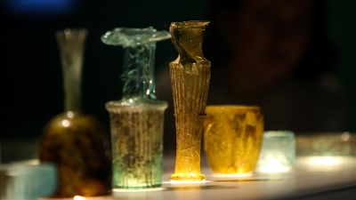 The newly conserved ancient glass vessels damaged during the 2020 Beirut port explosion displayed at the British Museum in London The newly conserved ancient glass vessels damaged during the 2020 Beirut port explosion displayed at the British Museum in London