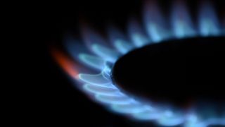  In this file photo illustration taken on February 2, 2022, gas is seen burning on a domestic hob in Brighton, southern England.