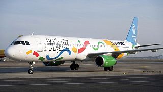 An aircraft of the low-cost of Wizz Air airlines painted in the colours of the logo of host city candidate Budapest for the 2024 Olympic and Paralympic Games.
