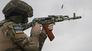 A volunteer soldier attends a training outside Kyiv, Ukraine, Saturday, Aug. 27, 2022.