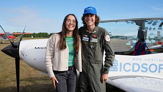 Seventeen year old Anglo-Belgian pilot, Mack Rutherford, right, poses with his sister Zara Rutherford after landing at the Buzet airfield in Pont-A-Celles, Belgium.