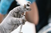 Registered pharmacist Sapana Patel, loads a syringe with Monkeypox vaccine at a vaccination site on Wednesday, Aug. 3, 2022.
