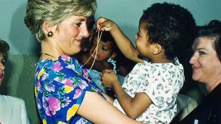 FILE - Britain's Princess Diana, the Princess of Wales, hugs and plays with an HIV positive baby in Faban Hostel, San Paulo, on April 24, 1991