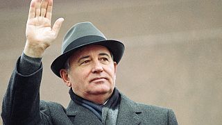 Soviet President Mikhail Gorbachev waves from the Red Square tribune during a Revolution Day celebration, in Moscow, Soviet Union, Tuesday, 7 Nov. 1989.
