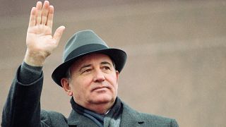 Following the tradition of Soviet party leaders, Mikhail Gorbachev greets the parade on Red Square from the rostrum of the Lenin Mausoleum