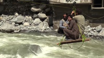 Flood victims walk for hours due to destroyed infrastructure in Pakistan