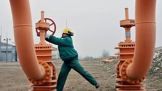An engineer of the FGSZ Ltd, Hungary's natural gas transporting company turns a gas pipeline valve forwarding natural gas from underground storage facilities.
