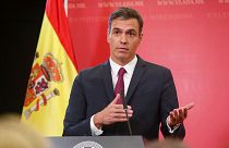 Spain's Prime Minister Pedro Sanchez talks to the media during a news conference in Skopje.