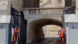 Two members of the Swiss Guards on duty at one of the entrances to the closed-off parts of The Vatican