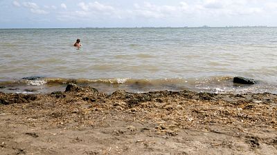 A woman bathes in the Mar Menor, Los Alcazares, Murcia, Spain. A woman bathes in the Mar Menor, Los Alcazares, Murcia, Spain.