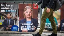 A man walks past election campaign posters in Stockholm, Sweden