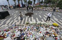 Floral tributes at a makeshift memorial in a park on the Nice's famed Promenade des Anglais.