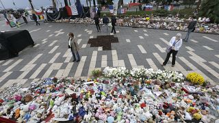 Floral tributes at a makeshift memorial in a park on the Nice's famed Promenade des Anglais.