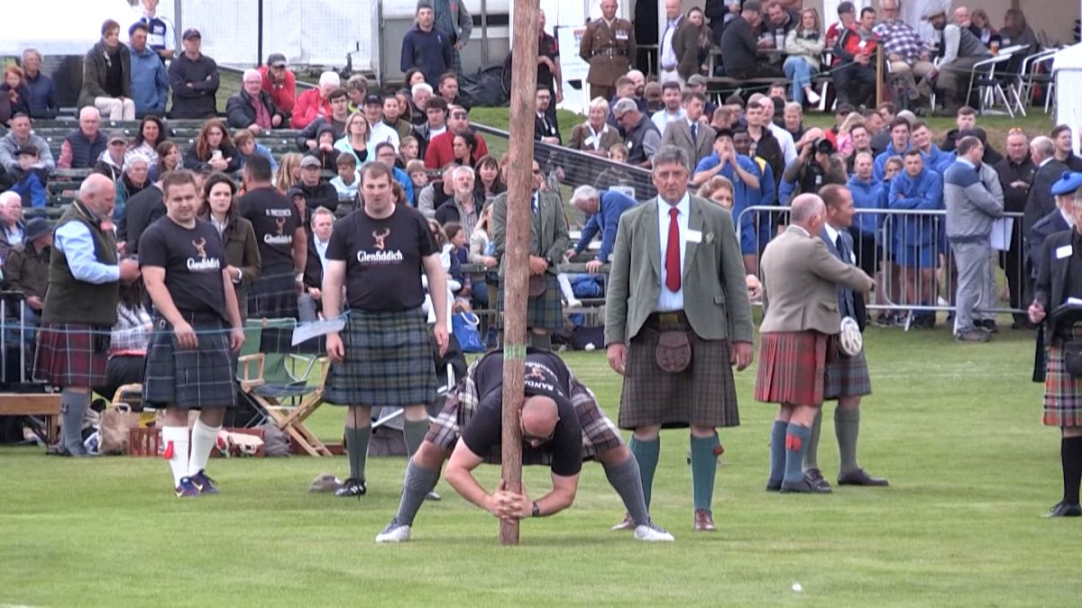 Competitor attemps caber toss