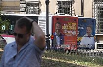 The electoral posters of the Northern League (left) and the Five Star Movement (right) on buses in Rome, Italy, on 1 September 2022.