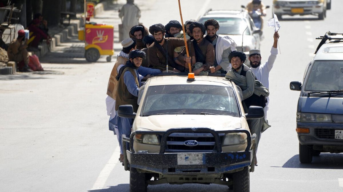 Members of Taliban on car in Kabul