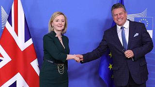 European Commissioner Maros Sefcovic greets British Foreign Secretary Liz Truss prior to a meeting at EU headquarters in Brussels, Feb. 21, 2022.