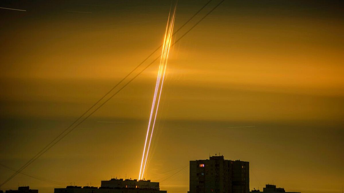Russian rockets launched against Ukraine from Russia's Belgorod region are seen at dawn in Kharkiv, Ukraine, early Saturday, Sept. 3, 2022.