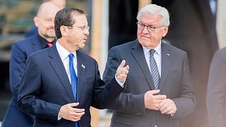 Israeli President Isaac Herzog, left, and German President Frank-Walter Steinmeier, right.