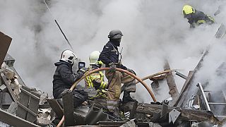 Ukrainian firefighters work among debris from destroyed buildings after the latest Russian rocket attack in center Kharkiv, Ukraine, Tuesday, 6 September, 2022.