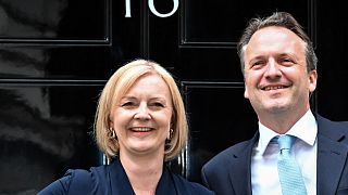Britain's newly appointed Prime Minister Liz Truss poses for photographers with her husband Hugh O'Leary outside 10 Downing Street, 6 September 2022