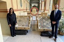 FBI agents pose with the 2,000 year old mosaic