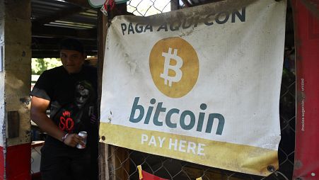 A sign promoting Bitcoin transactions is seen in a small shop in El Zonte beach, El Salvador, on of the places where the use of bitcoin has been most promoted, on August 2022
