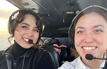 Mia (left) and her sister flying together in Greenland