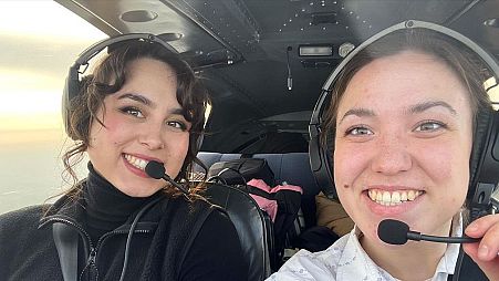Mia (left) and her sister flying together in Greenland