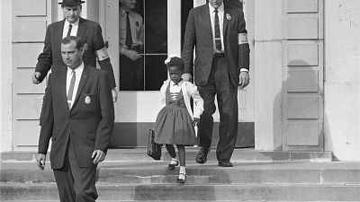 U.S. Deputy Marshals escort 6-year-old Ruby Bridges from William Frantz Elementary School in New Orleans, in this November 1960