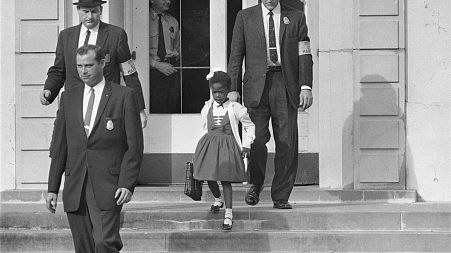 U.S. Deputy Marshals escort 6-year-old Ruby Bridges from William Frantz Elementary School in New Orleans, in this November 1960