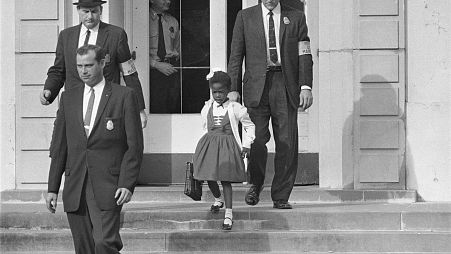 U.S. Deputy Marshals escort 6-year-old Ruby Bridges from William Frantz Elementary School in New Orleans, in this November 1960