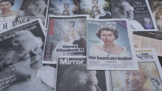 UK Newspapers devoted to the death of Queen Elizabeth II are seen in Manchester.