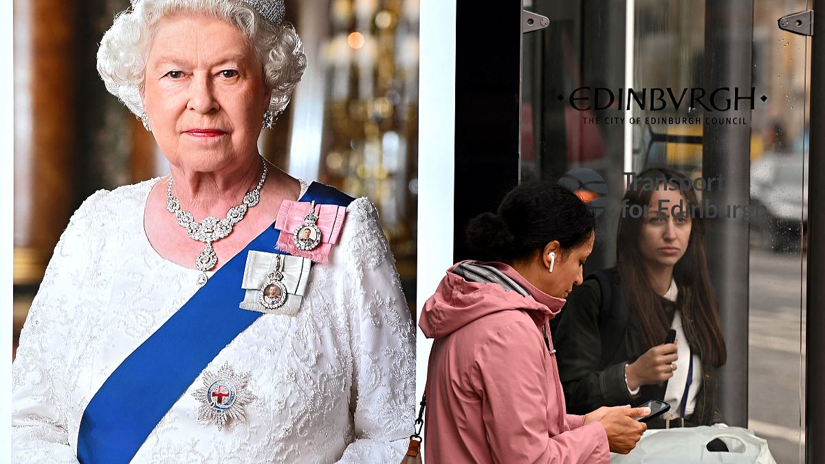 Pedestrians walk past an image of the late Queen Elizabeth II at bus stops in Edinburgh on September 9, 2022, a day after Queen Elizabeth II died at the age of 96.