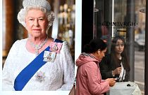 Pedestrians walk past an image of the late Queen Elizabeth II at bus stops in Edinburgh on September 9, 2022, a day after Queen Elizabeth II died at the age of 96.
