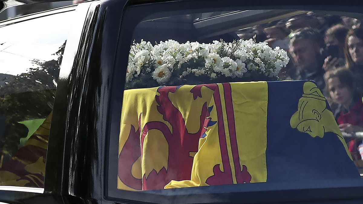The hearse carrying the coffin of Queen Elizabeth II, draped with the Royal Standard of Scotland, 11 September 2022
